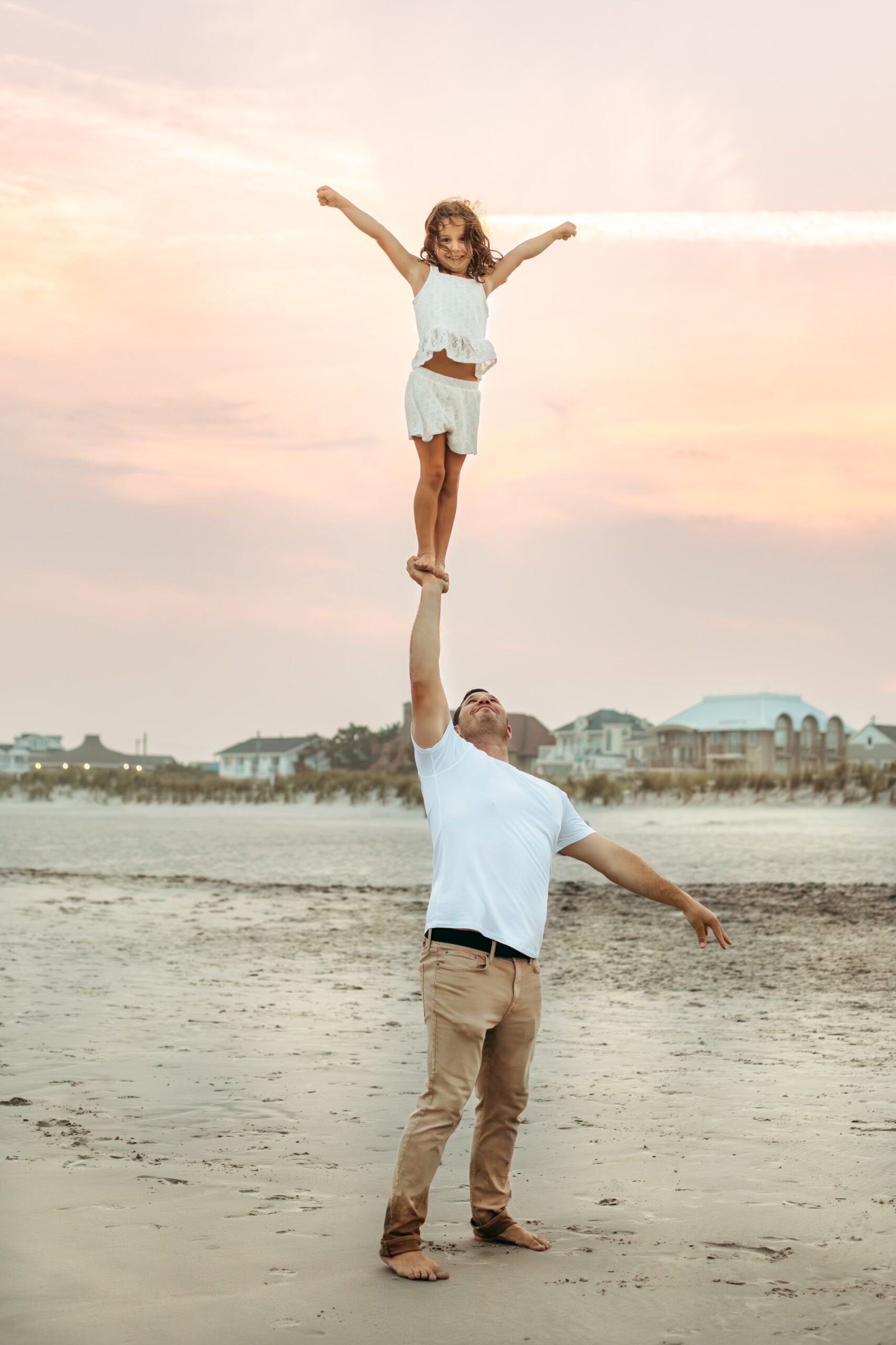 Photo of Founder Sean Wolf lifting up his daughter