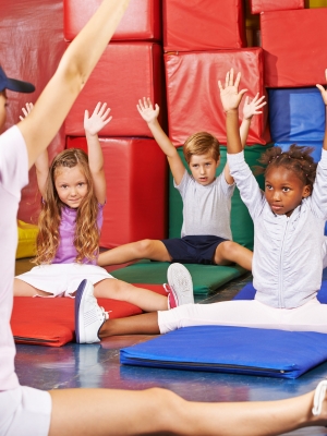 Group of young kids stretching in a cheer class